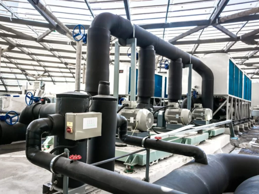 Chilled-water pipe insulation in a commercial HVAC plant room